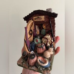 Rustic Cabin Figurine with Fishing Gear